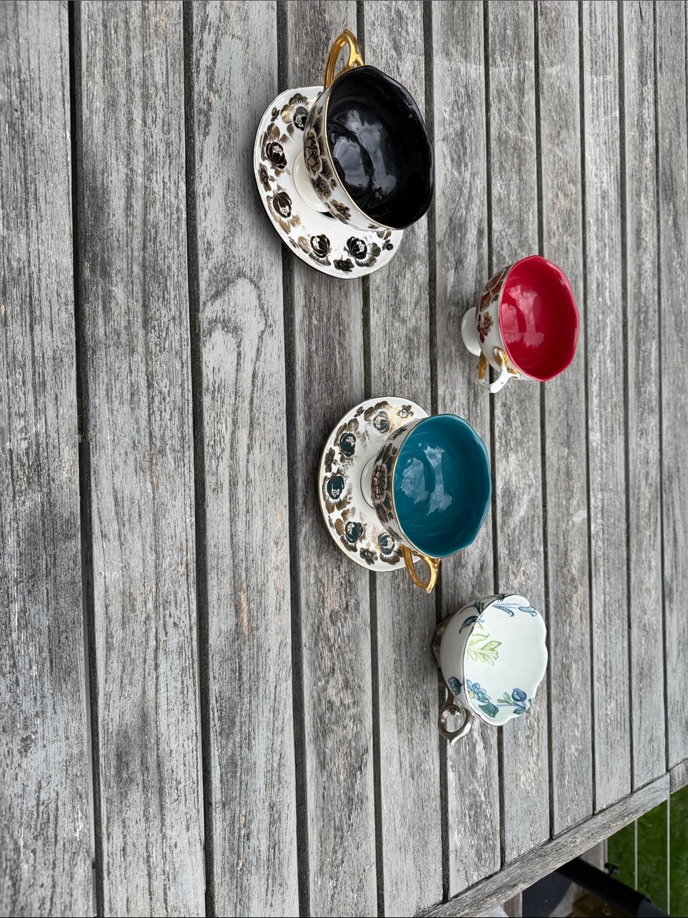 Anthropologie Floral Accent Mugs with Black, Teal, Red, and White Interiors
